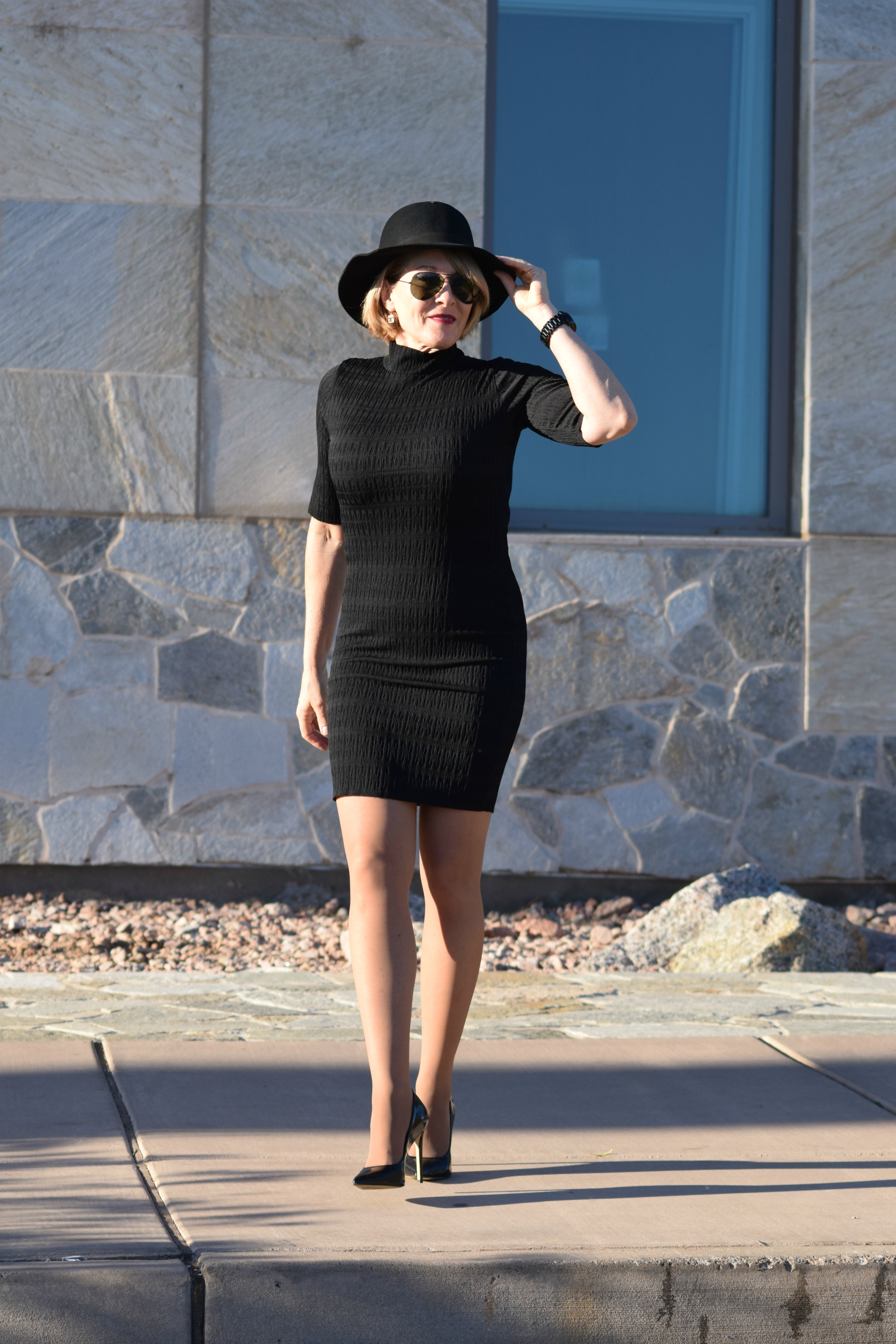 black dress and nude shoes