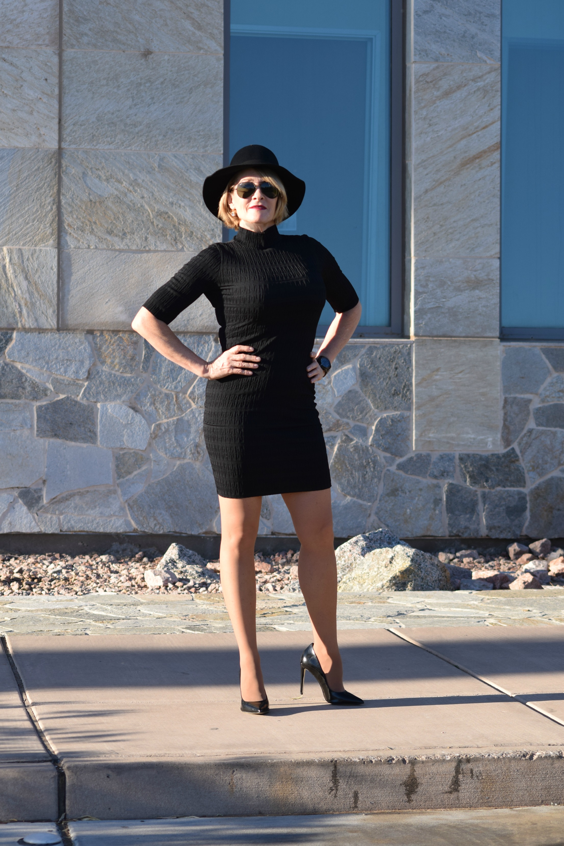 black dress and nude shoes