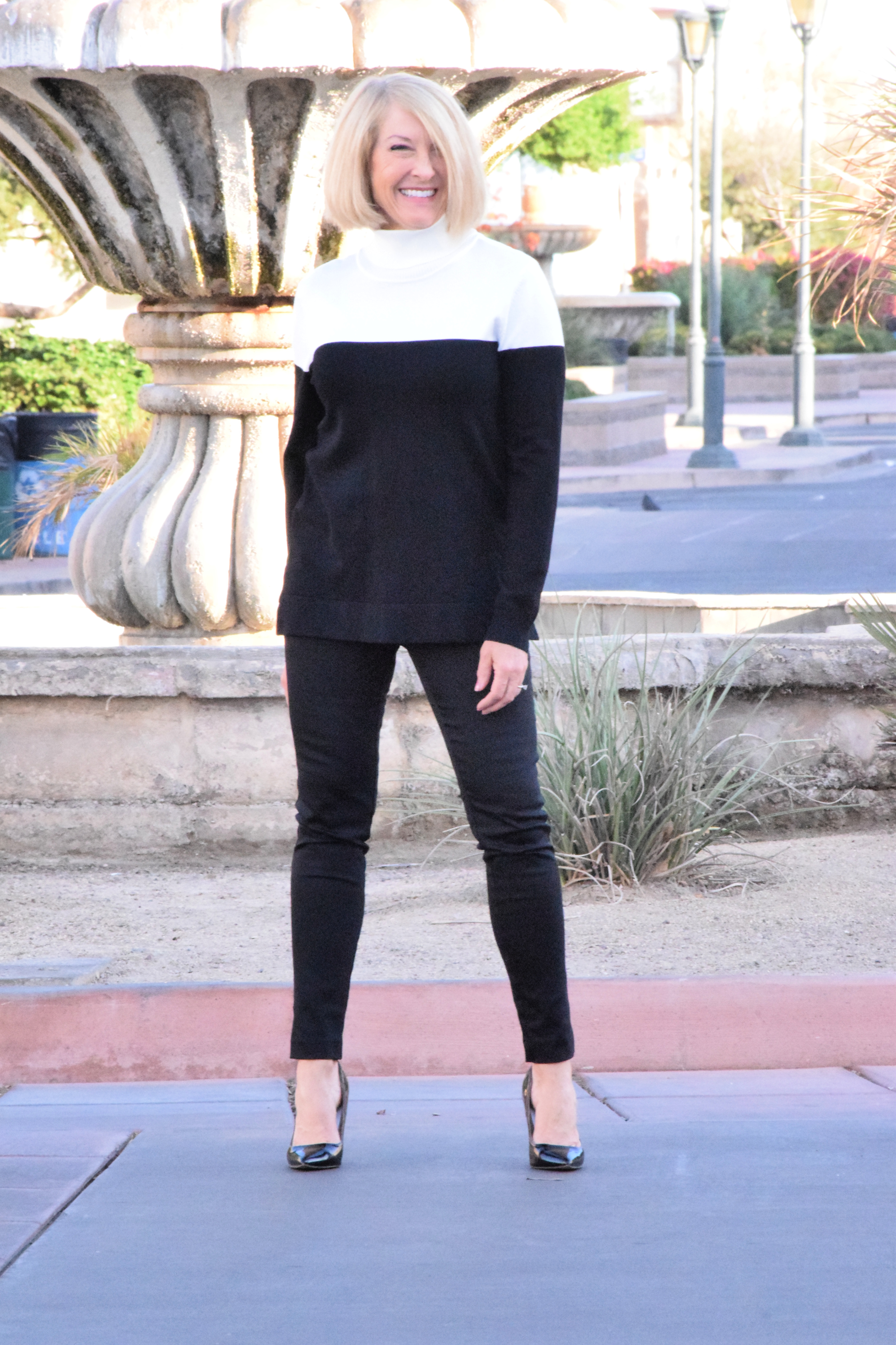 Chic and comfy Calvin Klein colorblock sweater in black and white.